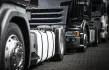 A fleet of commercial vehicles on the road, showcasing the importance of proper wheel installation.